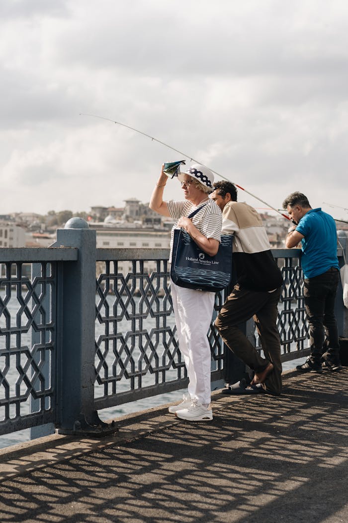 Home People fishing on the iconic Galata Bridge in Istanbul, Türkiye.